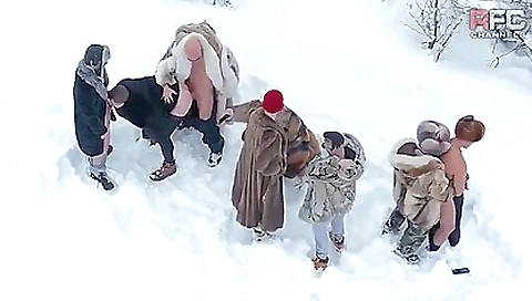 Two brunette women and a tattooed hunk share a huge cock